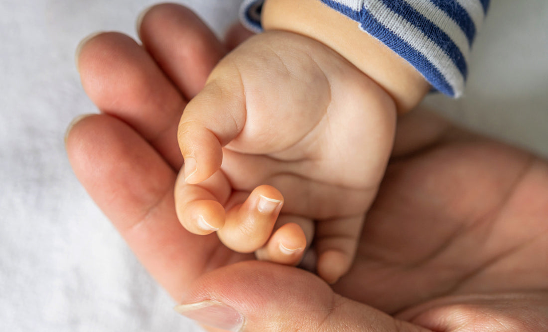 Baby hand, mom hand, baby mitten and socks  