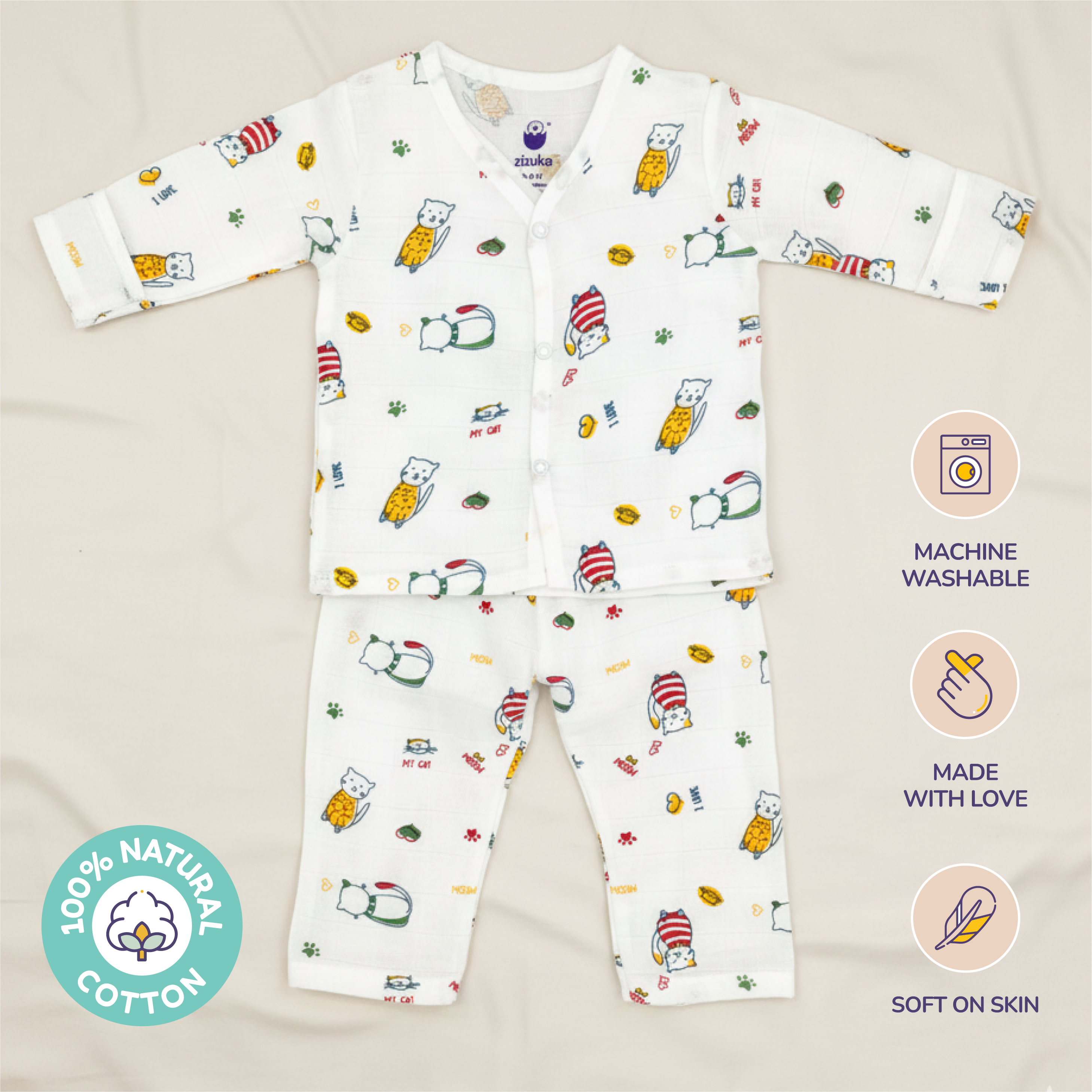 Children's pajama set with cat animal pattern on off-white background